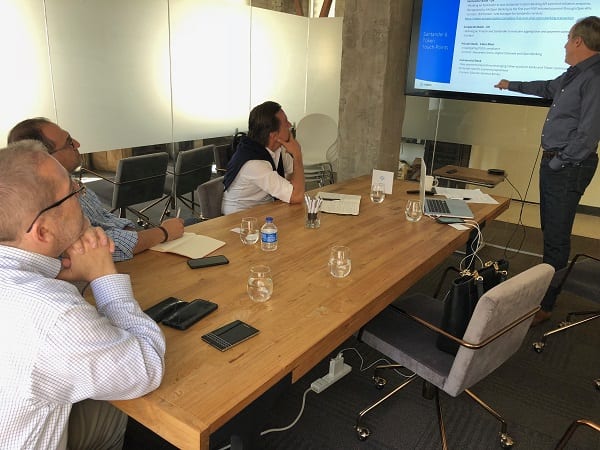 Banco Santander Mexico executives listen to a presentation at the startup Token. The company is seeking to make it easy for traditional banks to comply with new open banking regulations. 