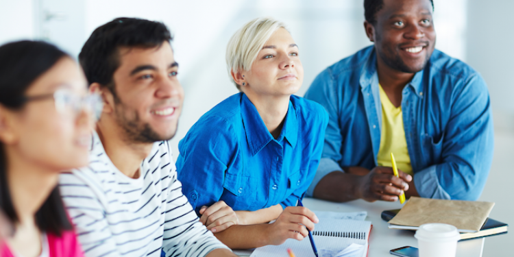 Diverse group of adults engaged in collaborative learning.